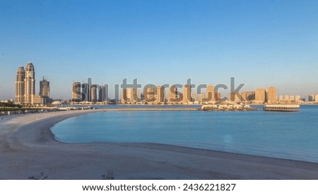 View from Katara Beach timelapse during sunset in Doha, Qatar, towards the Pearl. Residential buildings view