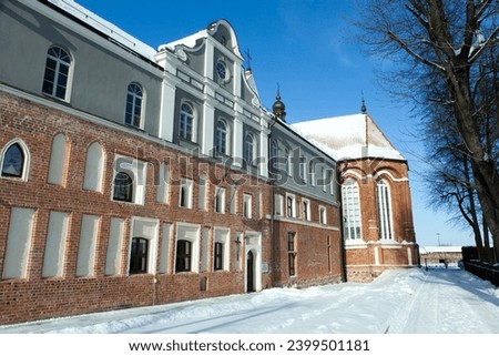 The view of Kaunas old town medieval house and a church in a background during the Winter (Lithuania).