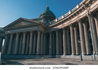 View of the Kazan Cathedral's grand colonnade and dome in St. Petersburg, Russia, under a clear blue sky. The neoclassical architecture and iconic columns highlight its historic significance - Powered by Shutterstock