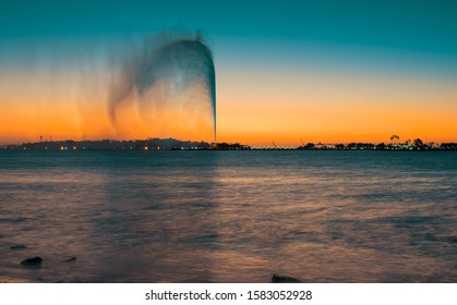 View of the King Fahd's Fountain, the world's tallest fountain, seen from the South Corniche, Jeddah, Saudi Arabia, with a beautiful sunset in the background