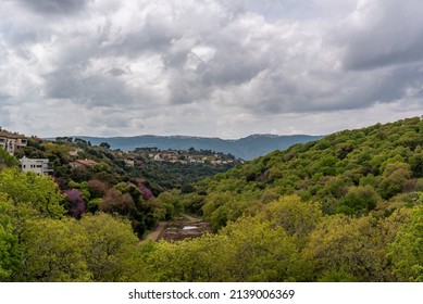 View From Kiryat Tivon Of The Hills,valley Between, Homes Near The Town Center And The Carmel Mountains In The Background On A Clouy Day In Israel.
