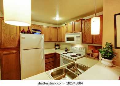 View Of Kitchen Cabinets With Sink And White Old Appliances