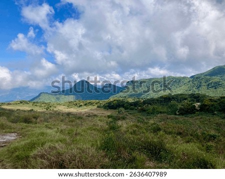 View of Knuckles Mountain Range in Sri Lanka as clouds roll over on a sunny day