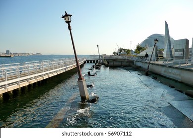 A view of the Kobe Earthquake Memorial Park, where a piece of the harbor is being left untouched in its wrecked state.