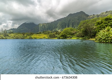 A view of the Koolau mountains as seen from the lake at Hoomaluhia Botanical Gardens in Kaneohe on Oahu, Hawaii