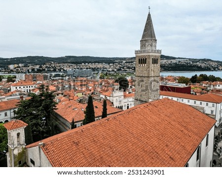 view of koper bell tower with red roofs in slovenian town (slovenia mediterranean coast) adriatic town downtown titov square trg Zvonik (Mestni stolp) balkans shingles historic village sea coastline