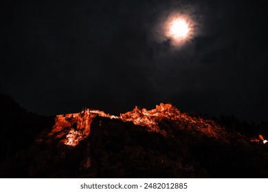 A View of Kotor Castle in the evening with the full moon in Montenegro - Powered by Shutterstock