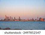 View of the Kuwait skyline - with the best known landmark of Kuwait City - during sunse. Kuwait Downtown view during sunset. 