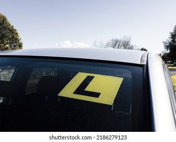 View Of L Learner Sticker Sign Under Car Windscreen. New Zealand.