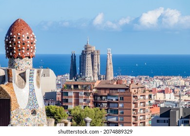 View Of La Sagrada Familia Of Gaudí And The Mediterranean Sea From The Famous Park Güell Of The Same Architect Antoni Gaudí