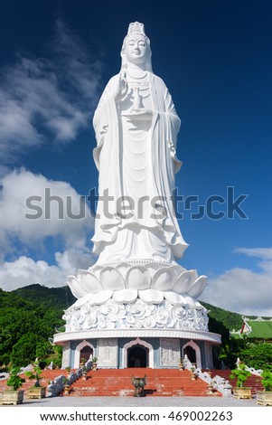 View of the Lady Buddha (the Bodhisattva of Mercy) at the Linh Ung Pagoda, Danang (Da Nang), Vietnam. Majestic white Buddha statue on blue sky background.
