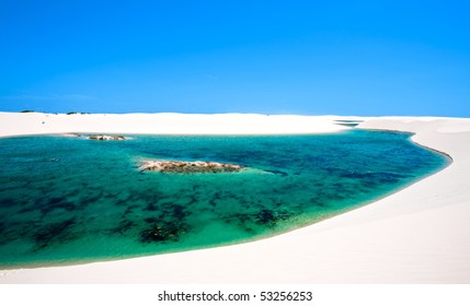 View Of Lagoa Azul In Desert White Sand Dunes Of The Lencois Maranheses National Park In Brazil