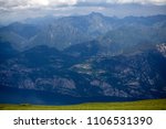 View of Lake Garda and surrounding mountains from Baldo Mountain. Beautiful landscpae background.