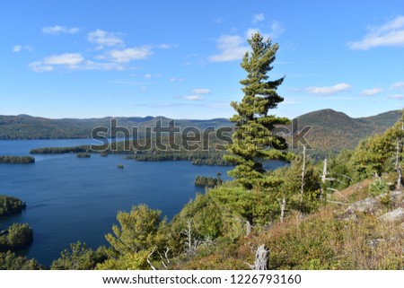 View of Lake George from the summit of Shelving Rock mountain in the Adirondacks on a beautiful sunny day.