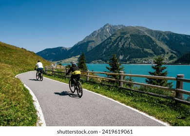 View of Lake Resia with its cycle pedestrian path in South Tyrol - Powered by Shutterstock