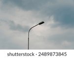 The view of a lamp against a blue sky