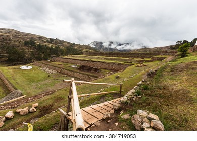 View Of The Land For Agriculture With Stone Walls And Wooden Bridge In The District Of Chinchero, Peru