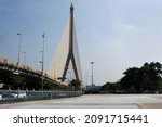View landscape cityscape and Saphan Phra Ram Part or Rama VIII cable-stayed bridge crossing the Chao Phraya River connect with Borommaratchachonnani Elevated Highway Road in Bangkok, Thailand