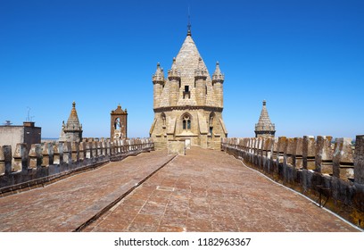 The view of the lantern tower over the gable roof of Evora Cathedral (Basilica Cathedral of Our Lady of Assumption). Evora. Portugal