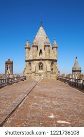 The view of the lantern tower over the gable roof of Evora Cathedral (Basilica Cathedral of Our Lady of Assumption). Evora. Portugal