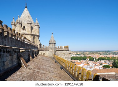 The view of the lantern tower over the gable roof of Evora Cathedral (Basilica Cathedral of Our Lady of Assumption). Evora. Portugal