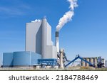 View of a large coal and biomass power plant on a clear summer day. Port of Rotterdam, the Netherlands.