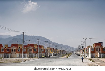 View of a large new cheap social housing development of single homes for low-income workers, in a poor community in the outskirts of Mexico City.