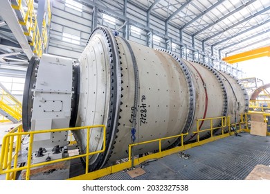 View of the large sag and ball mill in the mine factory. A ball mill is a type of grinder used to grind and blend materials for use in mineral dressing processes.