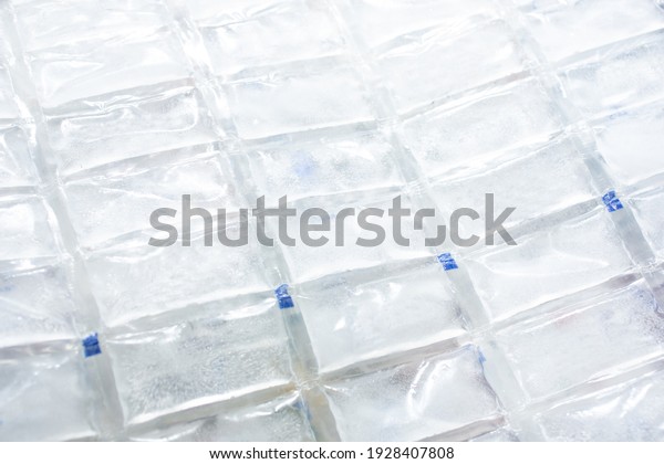 A view of a lattice of a plastic ice pack, as\
a background.