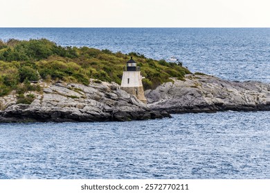 A view leaving Narragansett bay towards the Castle Hill Lighthouse in Newport, USA in the fall