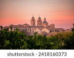 View from a lemon orchard of the Jerónimos Monastery in Murcia, Spain on a pink dawn