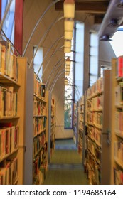 View of library stacks with windows in the background; zooming technique