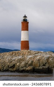 view of a lighthouse over a cloudy ocean