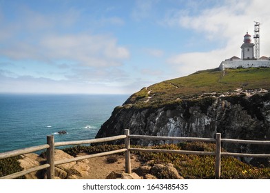 view of the lighthouse which stands cliffs over the ocean.  westernmost point of the europe