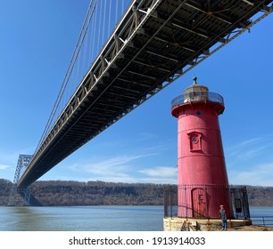 A view of the Little Red Lighthouse under the George Washington Bridge in Fort Washington Park, Washington Heights, New York City, USA