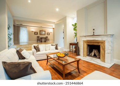 View Of Living Room With Classic Fireplace