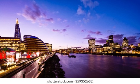 View Of London At Dusk With The Shard And River.