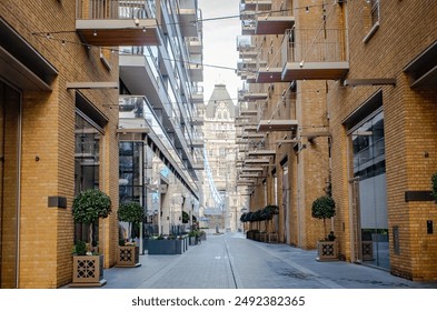 View of the London Tower Bridge along a back alleyway in Central London United Kingdom - Powered by Shutterstock