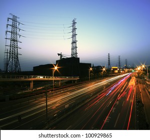 View long exposure photographs of urban night dusk Highway Traffic and transmission tower