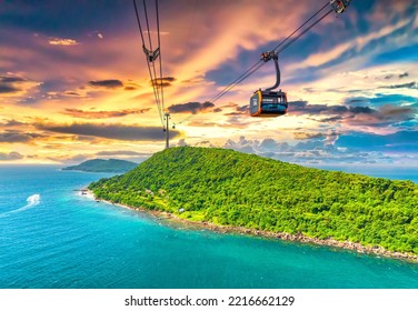 View of longest cable car ride in the world, Phu Quoc island, Vietnam, sunset sky. Below is seascape with tropical islands and boats.