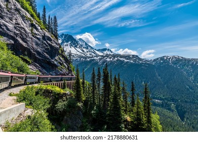 A view looking back from a train on the White Pass and Yukon railway on a bridge near Skagway, Alaska in summertime