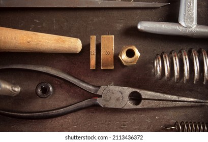 View Looking Down On A Table Of Various Book Binding Tools For Use By Hand