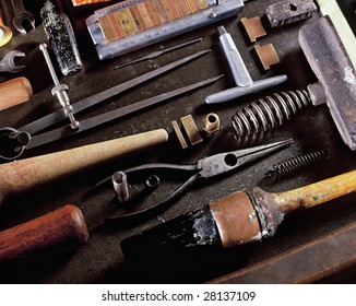 View Looking Down On A Table Of Various Book Binding Tools For Use By Hand