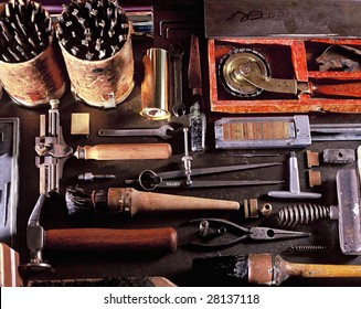 View looking down on a table of various Book Binding tools for use by hand