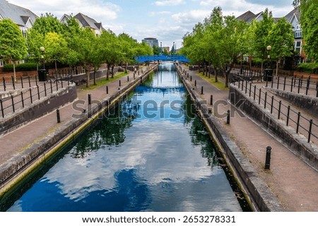 A view looking down a side canal beside the Detroit Bridge in Salford Quays,  Manchester,UK in summertime