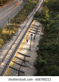 View looking down at train platform and person walking