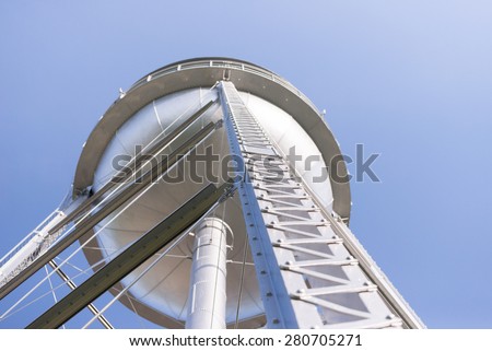 View looking up at a metal water tower