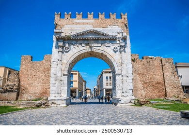 A view looking through the Arch of Augustus at Rimini, Italy in summertime