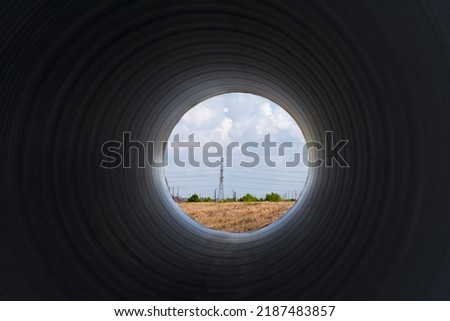View looking through large construction pipe