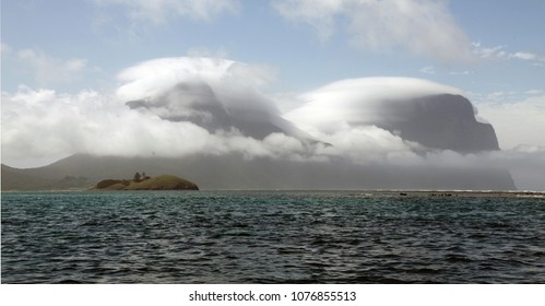 View Of Lord Howe Island With Clouds Covering Mount Gower And Mount Lidgbird